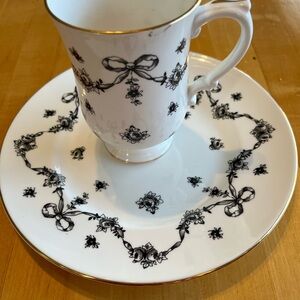Elegant White and Black Floral Teacup and Saucer Set